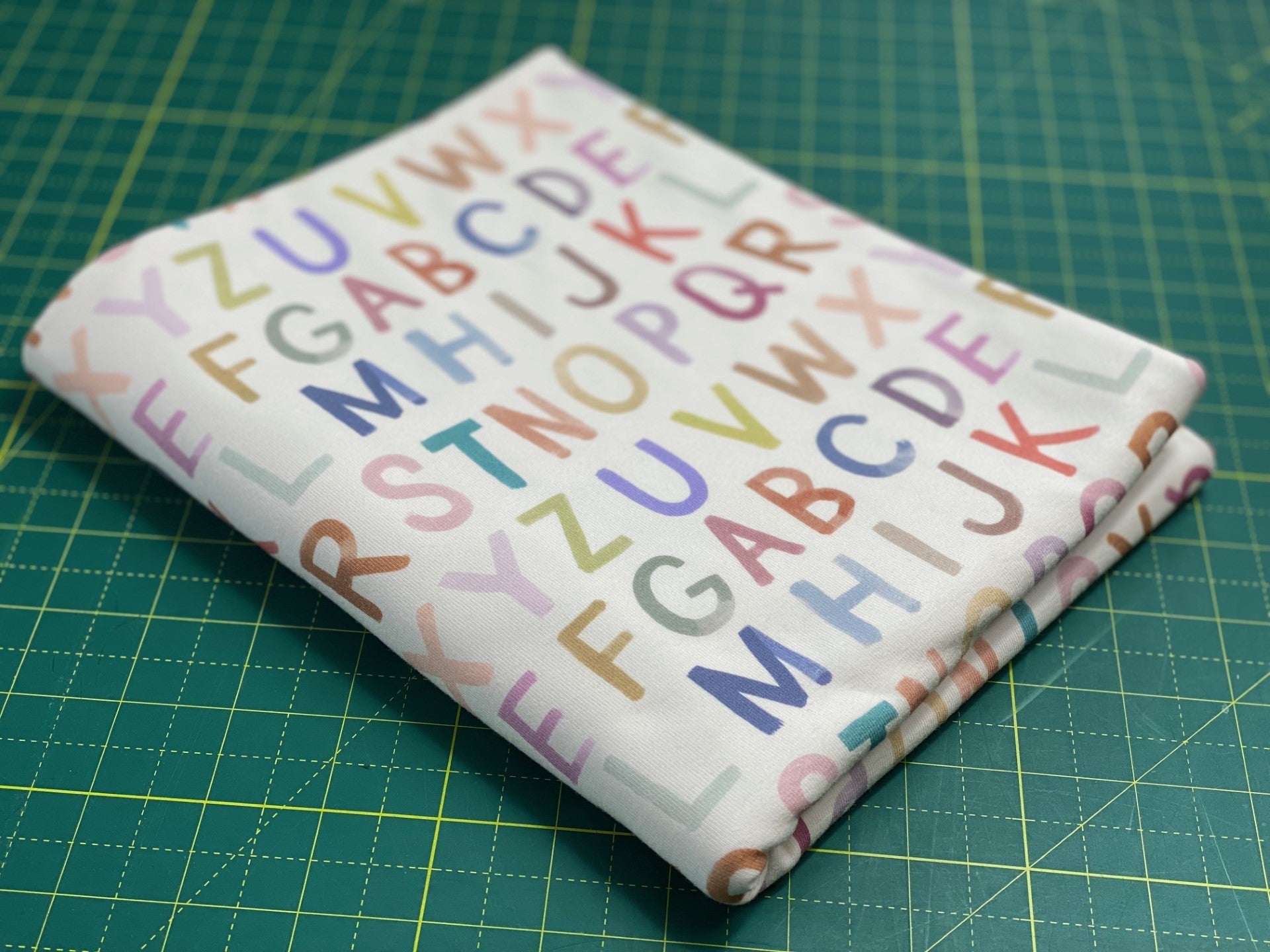 In Stock: Family Fabrics - ABC - Small Letters - 220 gsm Jersey - By the 1/2 yd - Little Rhody Sewing Co.