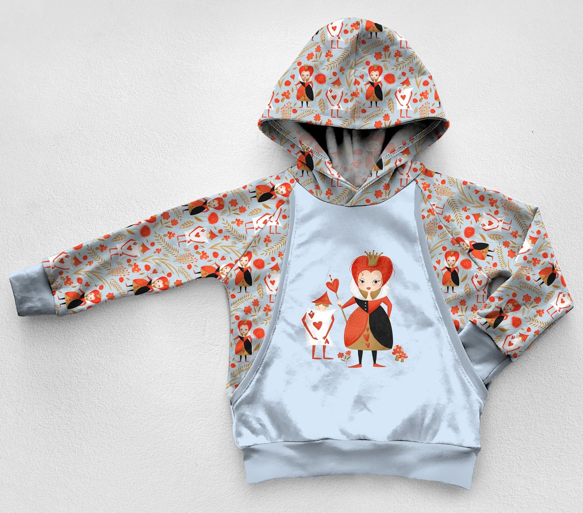 A light blue panel hoodie with a Queen of Hearts print. 
