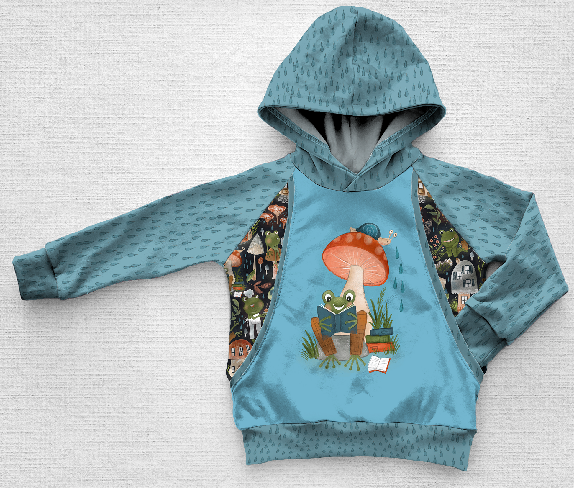 A blue panel hoodie with a frog, snail, and raindrops