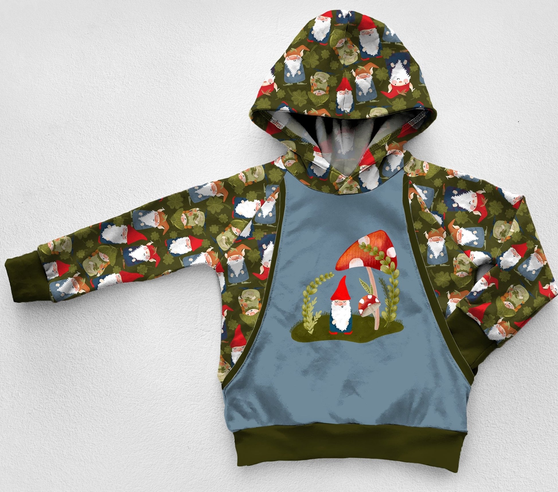 A green and blue hoodie with gnomes and shamrocks. 